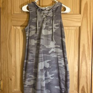 A small summer cotton dress with camouflage prints on it, and has a hood.